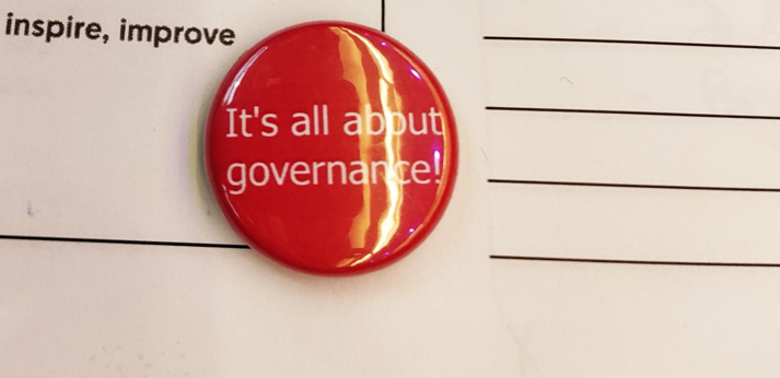 photo of a badge that says 'it's all about governance'