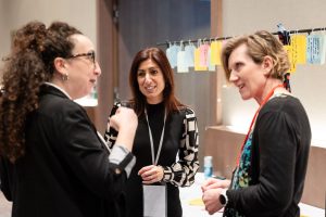 three people chatting to each other